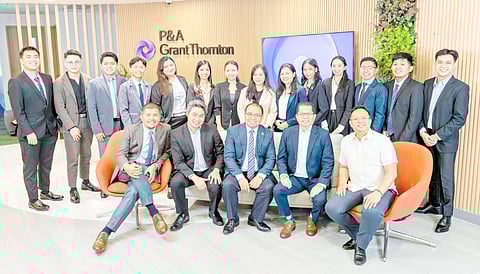 Posing with fresh graduates are P&A Grant Thornton leaders (from left) Elie Marcelo, business process solutions practice leader; Atty. Olivier D. Aznar, vice chairman and managing partner, and people and culture group leader; Romualdo V. Murcia III, chairman and managing partner; Ramil Nanola, audit and assurance practice leader; and Mhycke C. Gallego, advisory practice leader and knowledge management group leader.