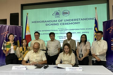 Clark International Airport Corporation president and CEO Jojit Alcazar and Philippine Pharma Procurement Inc. president and CEO Maria Blanca Kim Lokin sign a memorandum of understanding on the establishment of a pharmaceutical logistics and distribution center within Clark Aviation Capital, with CIAC and PPPI officials as witnesses.