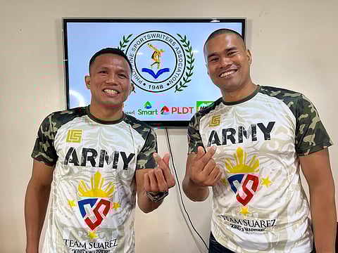 Filipino challenger Charly Suarez (left) and trainer Delfin Boholst are upbeat about their chances for next month’s world title shot in San Diego, California.