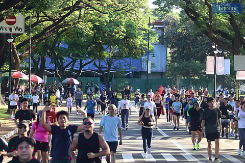(FILES) Individuals jog around the academic oval of the University of the Philippines in Diliman, Quezon City, during the Araw ng Kagitingan holiday break, Wednesday, 9 April 2025.