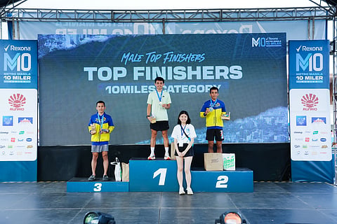 Jason Darrel Orduña (middle) celebrates after winning the Rexona Metro Manila 10 Miler Series 2025 last Sunday at Quirino Grandstand in Manila. 