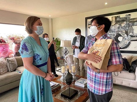 Then-presidential aspirant Bongbong Marcos received local delicacies from then-Davao City Mayor Sara Duterte after a meeting in Cebu City in November 2021, brokered by Senator Imee Marcos.