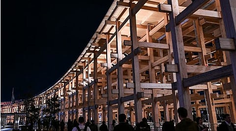Visitors walk past the ‘Grand Ring.’