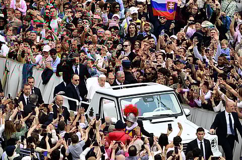 POPE Francis greets the faithful from the popemobile after Easter Mass at St. Peter’s Square in the Vatican on 20 April. 