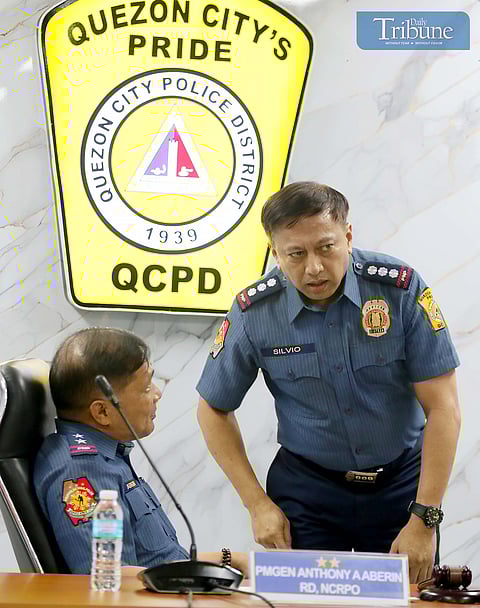 (FILE) NCRPO Chief, Pbgen Anthony A. Aberin with QCPD OIC Pcol Randy Glenn Silvio 