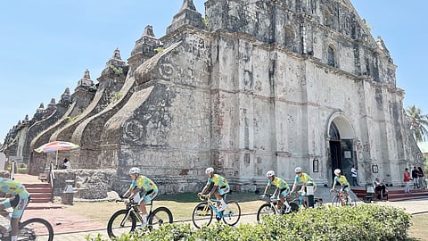 Riders of Excellent Noodles make their move after saying their prayers at the world-renowned Paoay Church in Ilocos Norte on Wednesday ahead of the opening stage of the Tour of Luzon.