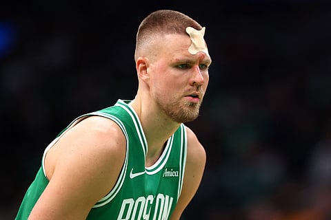 Kristaps Porzingis of the Boston Celtics sports a bandage after being elbowed by Goga Bitadze of the Orlando Magic in Game 2 of their Eastern Conference playoff series.