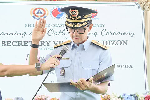 TRANSPORTATION Secretary Vivencio B. Dizon takes his oath as he is appointed to the Philippine Coast Guard Auxiliary with the honorary rank of auxiliary vice admiral.