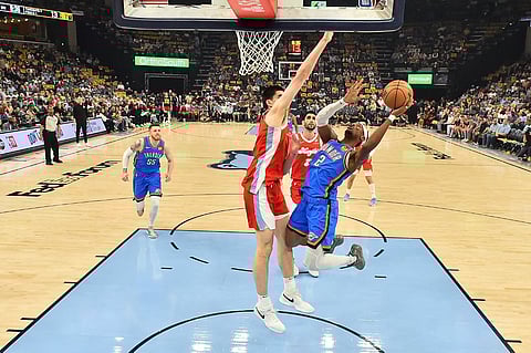 Shai Gilgeous-Alexander #2 of the Oklahoma City Thunder goes to the basket against Zach Edey #14 of the Memphis Grizzlies during the second half of Game Four of the Western Conference First Round NBA Playoffs at FedExForum on 26 April 2025 in Memphis, Tennessee. 