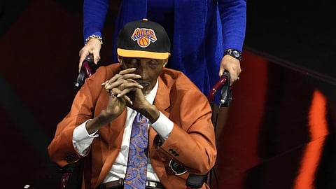 Former New York Knicks star Dick Barnett, shown on stage during his 2024 Basketball Hall of Fame induction ceremony, has died at age 88, the NBA club announced 