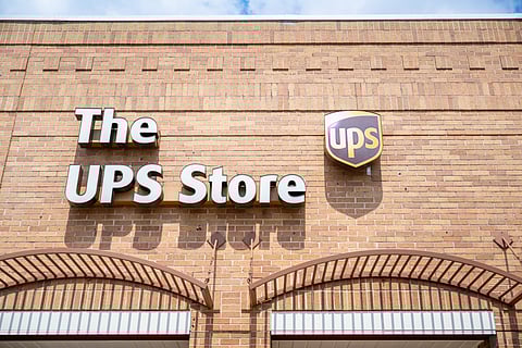 A UPS store exterior photographed in Austin, Texas, on 29 April 2025. The company is planning to cut 20,000 jobs and close 73 facilities worldwide following a significant drop in business with Amazon.