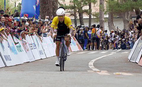 Korean Joo Daeyoung of Gapyeong Pro Cycling smiles as he crosses the finish line in Stage 8 of the 2025 Tour of Luzon on Thursday at the Camp John Hay in Baguio City.