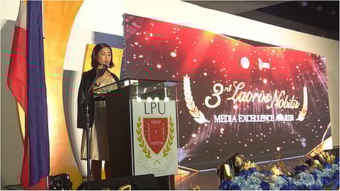 LPU Cavite Communication Program chair Mary Grace Arroyo-Vasquez delivers her opening remarks for the Laurus Nobilis Media Excellence Awards night.