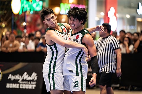 EARL Adabam and JC Macalalag celebrate after leading La Salle to its third straight UAAP 3x3 men’s basketball title late Sunday at the Ayala Malls Manila Bay in Parañaque City.