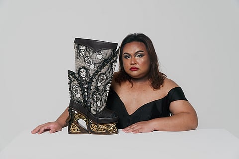 Benilde Fashion Design and Merchandising homegrown talent Fred Leysa 
with his award-winning shoe design Alkab.