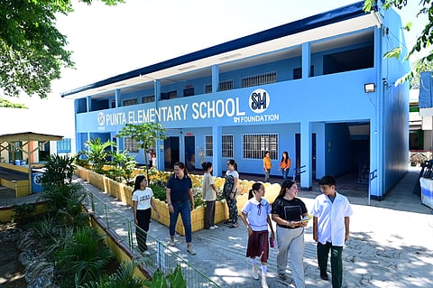 The two-story, four-classroom school building at the 88-year-old Punta Elementary School in Tanza, Cavite, turned over by SM Foundation and SM Prime in November 2020, now caters to classes from Grades 3 to 6, some of which were previously held at the school’s covered court pre-pandemic.