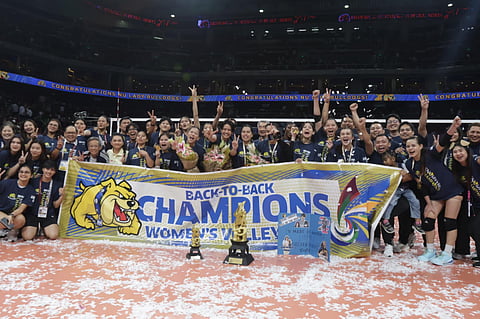 THE NU Lady Bulldogs celebrate after beating the La Salle Lady Spikers, 25-19, 25-18, 25-19, to win their third UAAP women’s volleyball title in four years on Wednesday at the Mall of Asia Arena.  