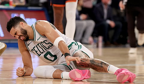 JAYSON Tatum of the Boston Celtics grimaces in pain after tearing his right Achilles during Game 4 of their NBA Eastern Conference Playoffs series against the New York Knicks.   
