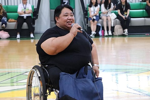 PARALYMPIAN Adeline Dumapon-Ancheta preaches the importance of inclusivity in sports during a friendly game between Saint Benilde and persons with disabilities recently. 