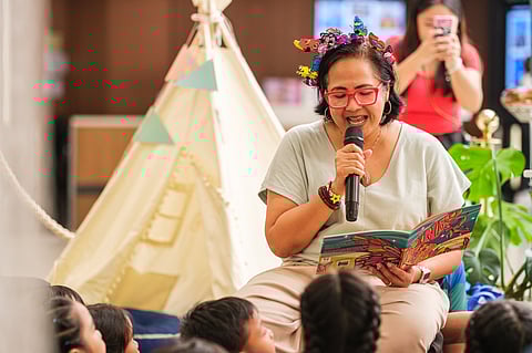 Author and storyteller Anya Santos-Uy reads her books to young audiences during the Earth Day-themed Read with Us session at SM Podium, held in partnership with iBBY Philippines.
