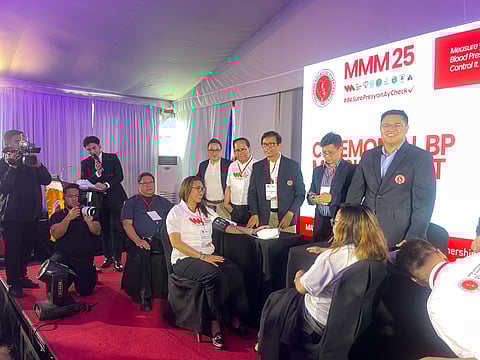 Dr. Alejandro Diaz, current president of the Philippine Society of Hypertension, demonstrates to the media the proper procedure for taking blood pressure.