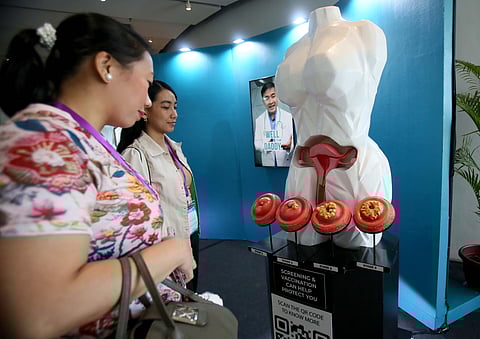 Stages of struggle Women pause before a stark visual journey — from Stage 1 to Stage 4 — of cervical cancer during the Summit for Private Schools themed One Community Against HPV. The display, like the disease it depicts, is a quiet yet urgent call to awareness.