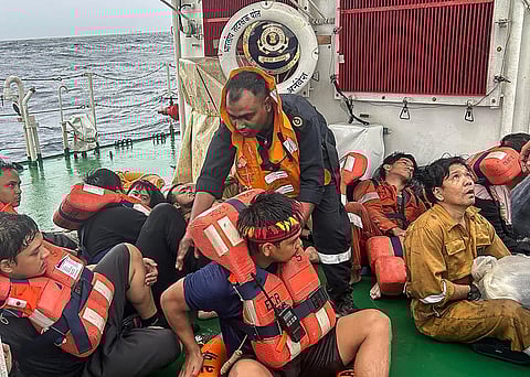S.O.S. answered An Indian Coast Guard crew member (standing) tends with brotherly affection to distraught seafarers saved from a watery grave following the sinking of a Liberian-flagged container ship off India’s southern coast of Kerala. All 24 mariners from the stricken ship, including an undetermined number of Filipinos, were rescued.
