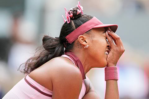 NAOMI Osaka reacts after absorbing a three-set loss to Paula Badosa in the first round of the women’s singles event of the French Open.