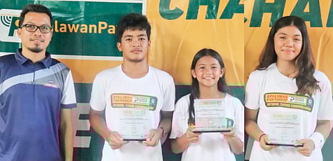 Izabelle Camcam (right) and co-MVP Aizelle Libonfacil (second from right) hold their trophies alongside boys’ MVP Vincent Nadal (second from left) and PPS-NTC Regional OIC Dr. Pete Bandala during the awards ceremony of the Dipolog City National Tennis Junior Championships in Zamboanga del Norte.
