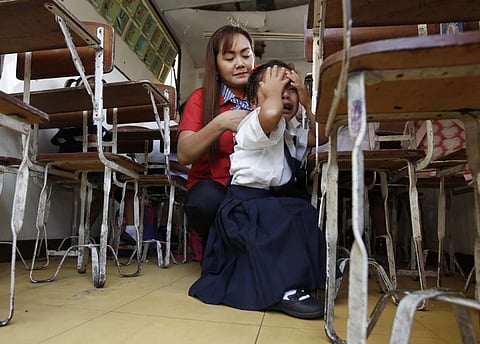 A student in Manila cries during the opening of classes last school year, the same fate for parents this coming school year, as prices of some school supplies rise, as announced by the Department of Trade and Industry on Friday. 