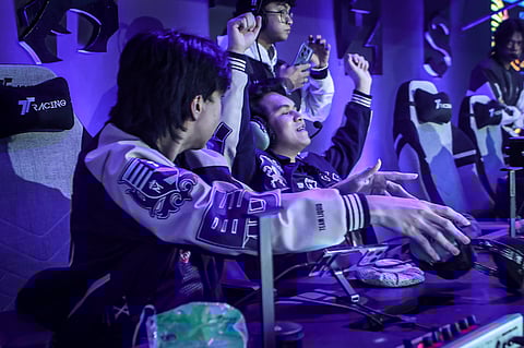 KarlTzy raises hands in victory