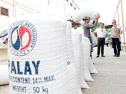 PRESIDENT Ferdinand Marcos Jr., accompanied by Agriculture Secretary Francisco Tiu Laurel Jr., inspects rice stocks at a National Food Authority warehouse in San Ildefonso, Bulacan in this file photo taken on 28 May. The inspection came as the government prepares to roll out P20-per-kilo rice in Bacolod City, one of the pilot areas for the administration’s targeted rice subsidy program.