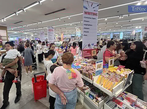 WITH the school opening just days away, parents and their kids are already flocking a book store in Quezon City on Sunday to buy school supplies
