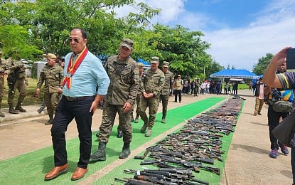 ASG-FREE. Presidential Peace Adviser Secretary Carlito Galvez Jr. (left) oversees the turnover of loose firearms in Basilan on Monday (June 9, 2025). In the same event, the province was declared free from the influence and presence of the terrorist Abu Sayyaf Group.