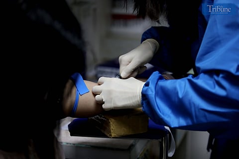 (JUNE 11, 2025) A Health worker take a blood sample to the patient for HIV testing for work requirements at Social Hygiene Clinic in Project 7, Quezon City, on June 11, 2025, The Department of Health (DOH) called for a national public health emergency following  a recent report that young Filipinos infected with human immunodeficiency virus have increased by 500 percent. Photo/Analy Labor