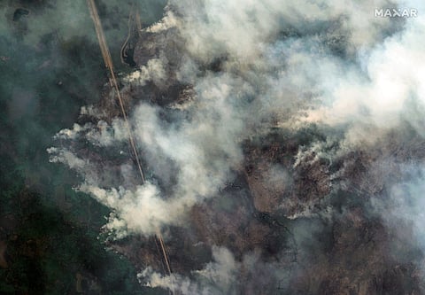  
This handout satellite picture courtesy of Maxar Technologies shows an overview of the Shoe Fire on Saskatchewan Highway 106, Creighton, Canada on 30 May 2025. Canada's wildfires, which have already forced evacuations of more than 26,000 people, continued their stubborn spread 3 June, with heavy smoke choking millions of Canadians and Americans and reaching as far away as Europe.
Alerts were issued for parts of Canada and the neighboring United States warning of hazardous air quality.
