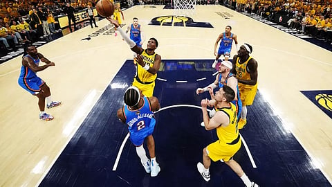 Bennedict Mathurin of the Indiana Pacers shoots the ball over Oklahoma City's Shai Gilgeous-Alexander in game three of the NBA Finals.