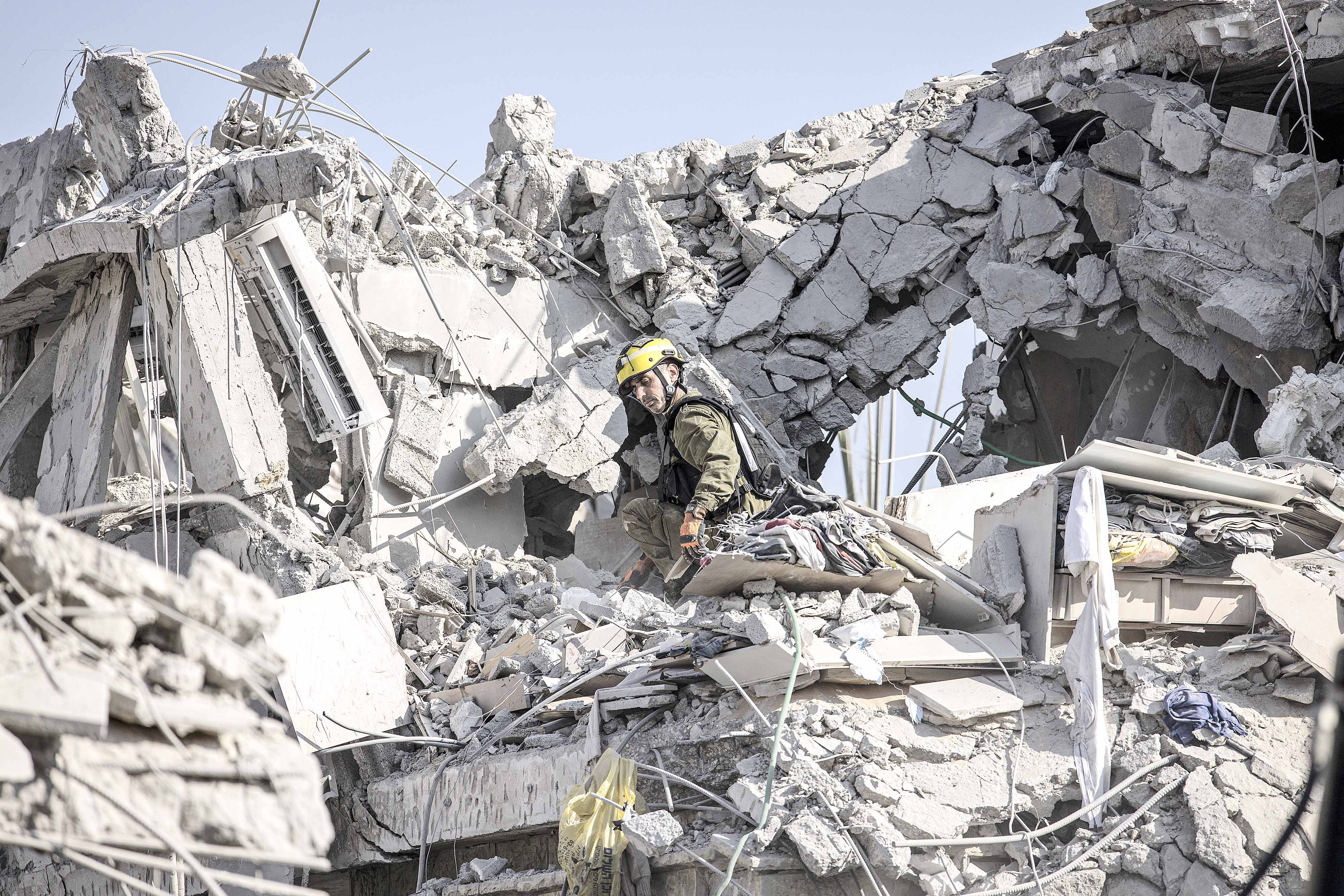 ISRAELI emergency responders inspect the site of a missile strike south of Tel Aviv on Saturday. Iran launched the attack after Israel’s massive bombardment of its nuclear and military facilities, which killed several top Iranian generals.