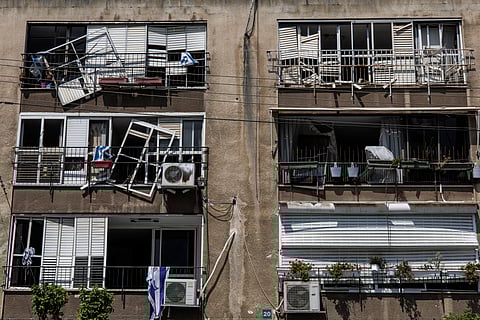 A DAMAGED building is pictured at a site in Tel Aviv hit by a missile fired from Iran on June 14, 2025. Israel's military said that its fighter jets were set to resume striking targets in Tehran, after announcing it had hit air defences in the Iranian capital area overnight, as Israel and Iran trade fire with such intensity for the first time following decades of enmity and conflict by proxy, with fears of a prolonged conflict engulfing the region.