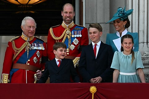 (L to R) Britain's King Charles III, Britain's Prince William, Prince of Wales, Britain's Prince Louis of Wales, Britain's Prince George of Wales, Britain's Catherine, Princess of Wales and Britain's Princess Charlotte of Wales, smile whilst standing on the balcony of Buckingham Palace after attending the King's Birthday Parade "Trooping the Colour" in London on June 14, 2025. The ceremony of Trooping the Colour is believed to have first been performed during the reign of King Charles II. Since 1748, the Trooping of the Colour has marked the official birthday of the British Sovereign. Over 1500 parading soldiers and almost 300 horses take part in the event.
