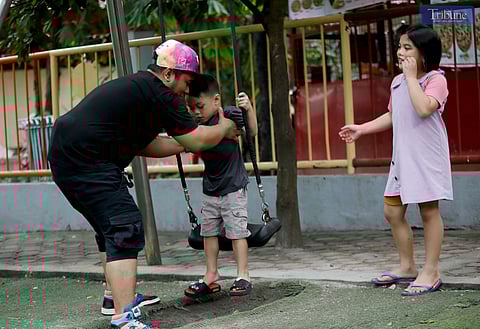 Father Christian Gotladera enjoys a day out with his three children at Quezon City Memorial Circle on Saturday, 14 June 2025, a day ahead of the Father’s Day celebration. [FILE PHOTO]