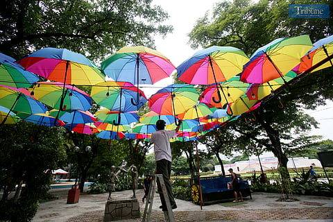 Workers install lights on the colorful umbrella display at the Quezon City Memorial Circle on Saturday, 14 June 2025. The installation is part of Love Laban, Pride PH, Quezon City’s official Pride Month celebration and a vibrant show of support for the LGBTQIA+ community.