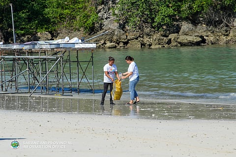 GLOBE employees and distribution partners help collect 100 bags of trash littering the shores of Sarangani Bay.