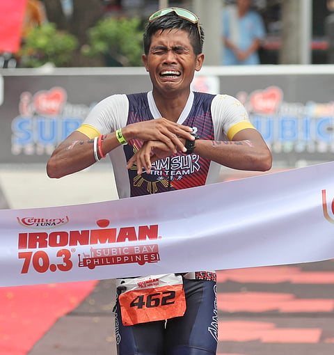 JOHN Patrick Ciron fights back tears as he crosses the finish line in 4:37:28 to conquer his first ever Century Tuna IRONMAN 70.3 Subic Bay title on Sunday.    