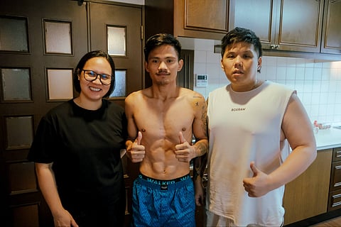 Filipino fighter Christian Araneta (middle) is on point just days before he guns for the vacant IBF light-flyweight title in Tokyo. Providing his nutritional needs is dietitian Jeaneth Aro (left) while handling his training is strategist Julius Erving Jungco.