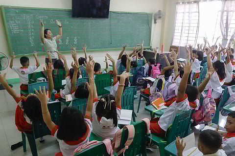 Kinder and elementary pupils of Pedro Cruz Elementary School join warm-up activities led by their teachers on the first day of classes, Monday, 16 June 2025.