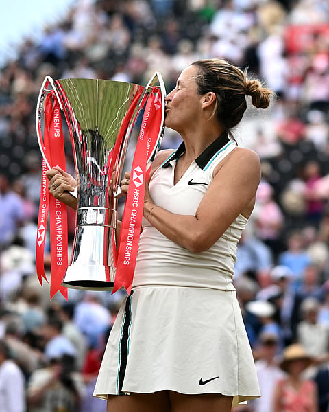 TATJANA Maria raises the trophy after beating Amanda Anisimova 6-3, 6-4 to become the first woman champion of the Queen’s Club Championship in 52 years.