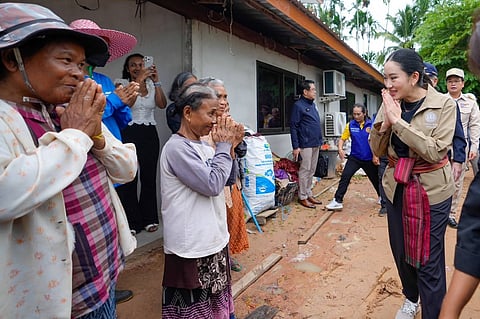 This handout photo from the Royal Thai Government taken and released shows Thailand’s Prime Minister Paetongtarn Shinawatra (right) greeting villagers during a visit to Kap Choeng District in Surin Province near the border with Cambodia. Thailand and Cambodia reached an agreement to reposition their troops in a disputed border area where a Cambodian soldier was killed last month in a military clash, both sides announced.