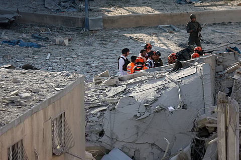 ISRAELI rescuers comb through rubble in Bnei Brak, east of Tel Aviv, on 16 June 2025, after Iran launched missile strikes on Israeli cities following Israel’s attack on military targets inside Iran.