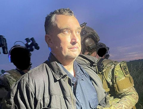 This unlocated handout photo released by the Ramsey County Sheriff’s Office shows Vance Boelter, the suspected killer of a Democratic Minnesota state lawmaker, as he was being apprehended.